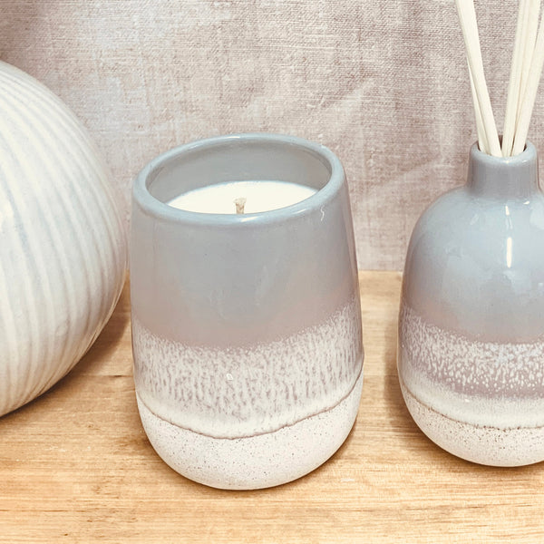 CLOSE UP OF GREY OMBRE GLAZED CANDLE